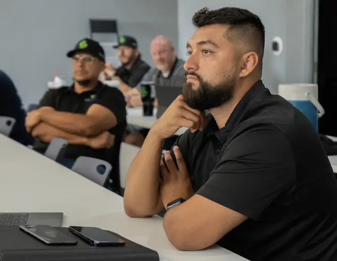 Employees listening intently during a company training session