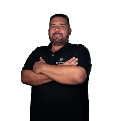 Fernando Zavala, founder and CEO of EcoEnergy Solutions, wearing the company polo shirt