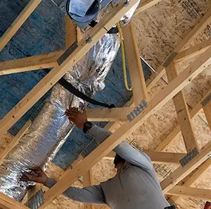 A couple looking at their new room with moving boxes