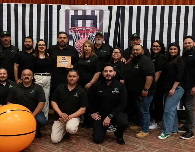 EcoEnergy Solutions team posing together at a company event