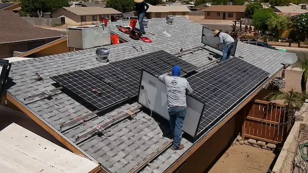 Dark solar panels on a modern dark tile roof