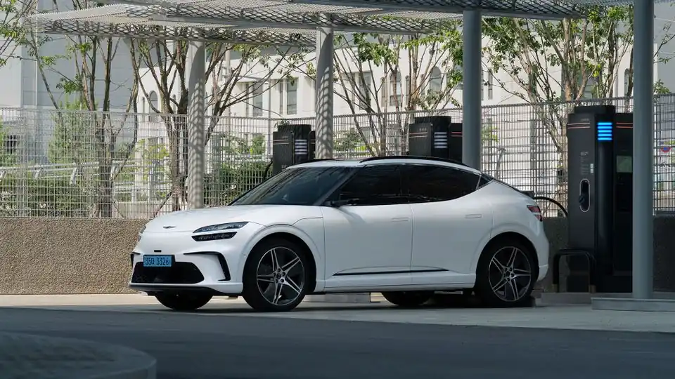 Electric Vehicle Parked Beside Charging Stations in a Covered Parking Area