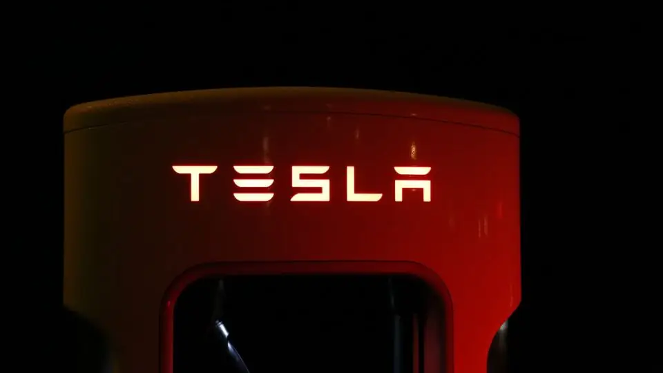 Illuminated Tesla Charging Station at Night