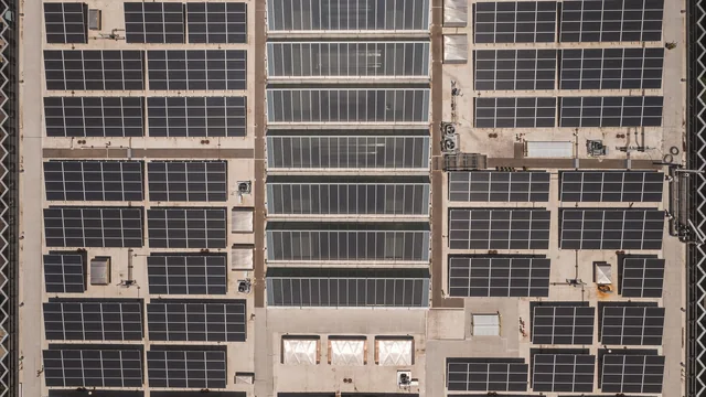 Rooftop Solar Panel Array on a Commercial Warehouse Building