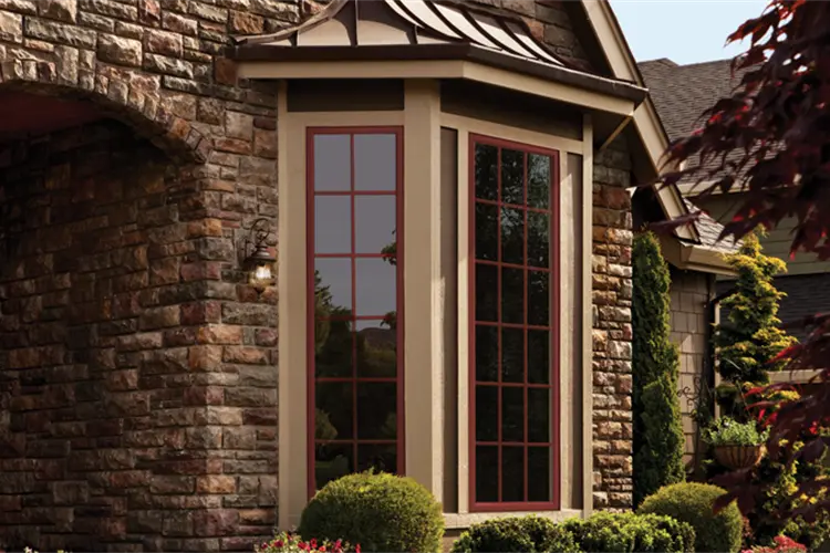 Stone home exterior with bay and casement windows in Yuma